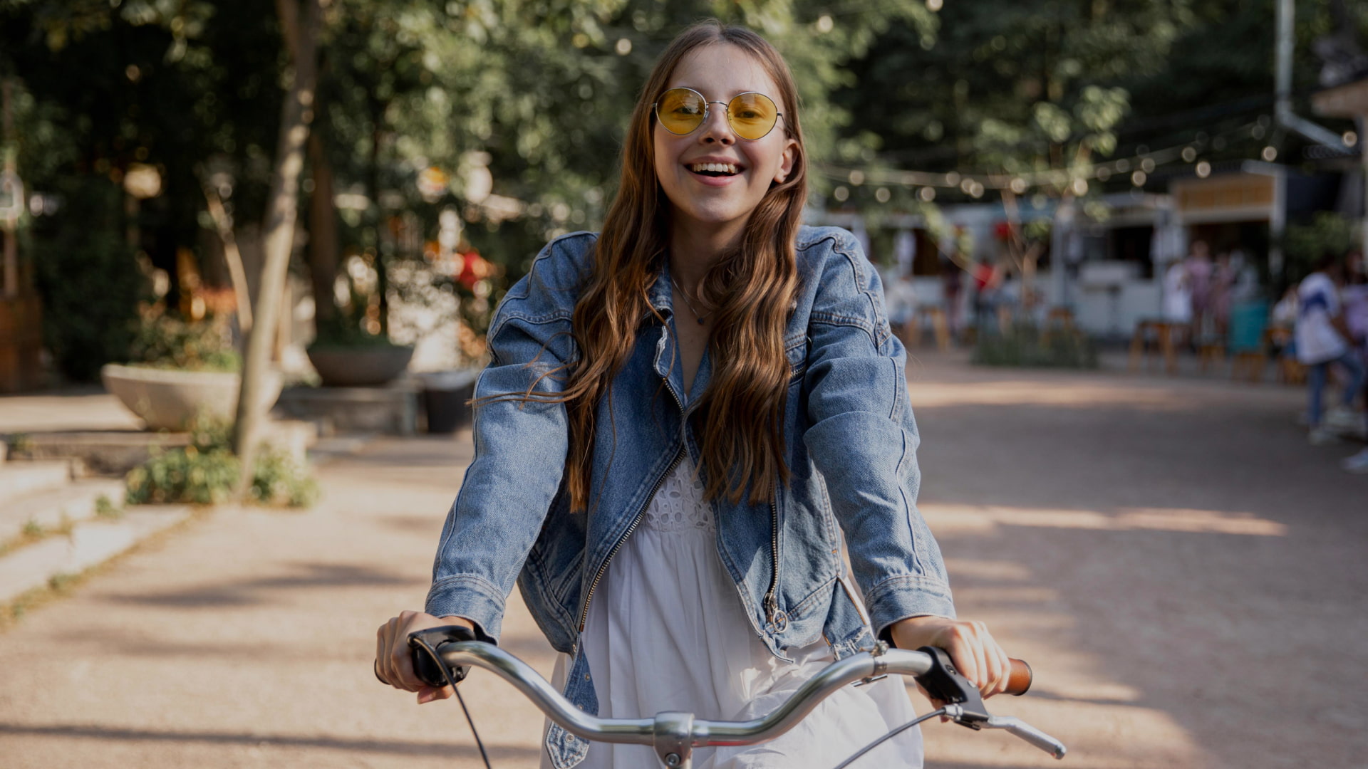 Contact Happy young man riding a bicycle