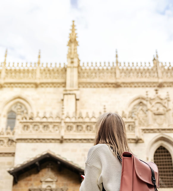 Granada 1 Woman with her back turned admiring the facade of the cathedral